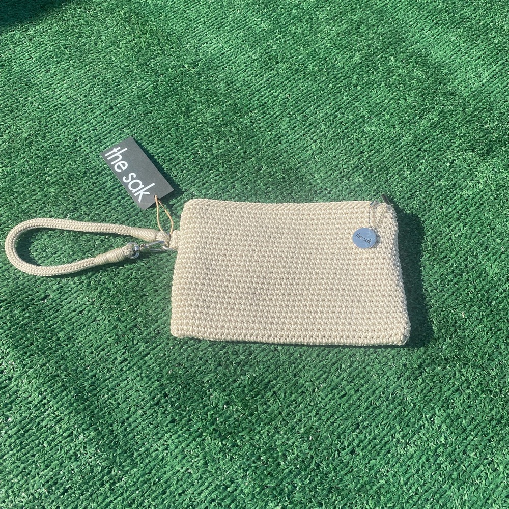 The Sak, wristlet. New. Cream color.